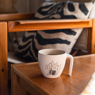 Hattifatteners Moomin Mug inside the house on table.